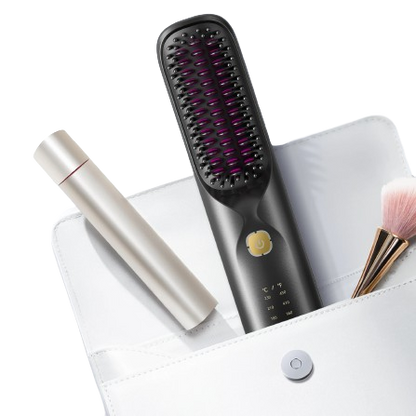 Black hair straightening brush with purple bristle tips on a white surface