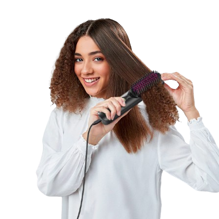 Woman using a hair straightening brush on her hair