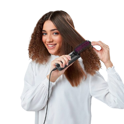 Woman using a hair straightening brush on her hair